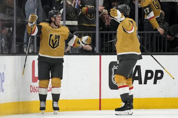 Vegas Golden Knights right wing Jonathan Marchessault, left, celebrates after scoring against the Tampa Bay Lightning during the first period of an NHL hockey game Saturday, Feb. 18, 2023, in Las Vegas. (AP Photo/John Locher)