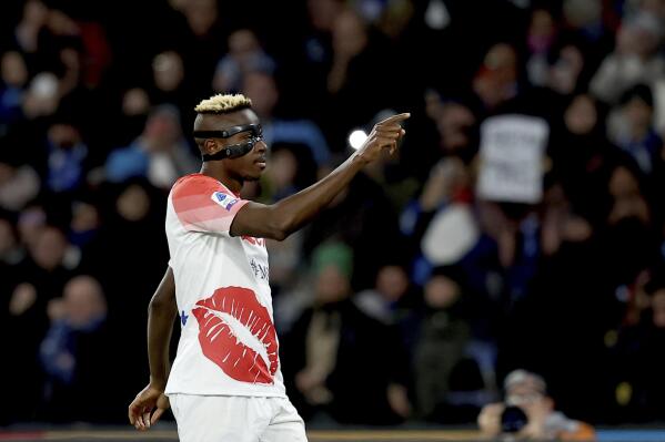 Napoli's Victor Osimhen celebrates after scoring his team's second goal, during the Serie A soccer match between Napoli and Cremonese at the Diego Armando Maradona stadium in Naples, Italy, Sunday, Feb. 12, 2023. (Alessandro Garofalo/LaPresse via AP)