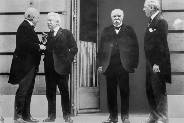 The Big Four of the Allies chat while gathering in Versailles for the Treaty of Versailles, which officially ended World War I, in this 1919 photo.  They are, left to right, David Lloyd George, of Great Britain, Vittorio Orlando, of Italy, Georges Clemenceau, of France, and Woodrow Wilson, United States President.  (ĢӰԺ Photo/File)