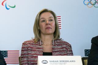 FILE - In this Feb. 18, 2020, file photo, United States Olympic and Paralympic Committee CEO Sarah Hirshland listens during a briefing with the U.S. Olympic and Paralympic Committee and Los Angeles 2028 organizers in Beverly Hills, Calif. A boycott of next year's Beijing Olympics will not solve any geopolitical issues with China and will only serve to place athletes training for the games under a “cloud of uncertainty,” according to a letter, Hirshland, the head of the U.S. Olympic and Paralympic Committee, wrote to Congress on Thursday, May 13, 2021. Her letter specifically addressed those who believe a boycott of the Winter Games next February would serve as an effective diplomatic tool to protest China's alleged abuses toward Uyghurs, Tibetans and Hong Kong residents.  (AP Photo/Evan Vucci, File)
