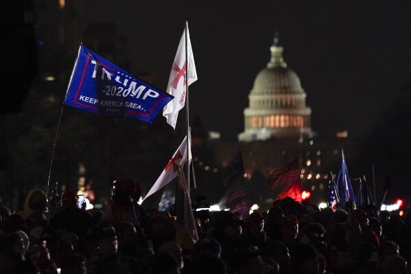 People attend a rally at Freedom Plaza Tuesday, Jan. 5, 2021, in Washington, in support of President Donald Trump. (AP Photo/Julio Cortez)