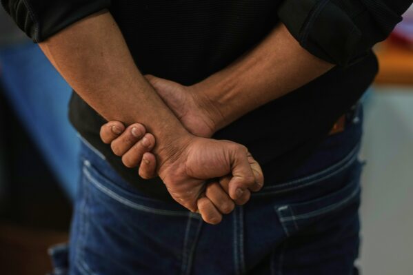 A Rohingya refugee who has not been identified due to safety concerns, talks to The Associated Press in New Delhi, India, about how his family was deported to an island in Myanmar, Friday, May 16, 2025. (AP Photo/Manish Swarup)