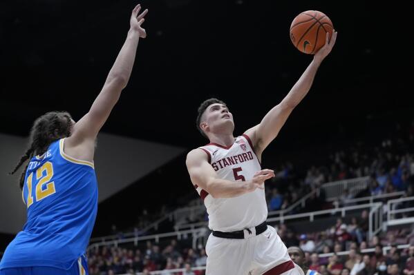 Stanford guard Michael O'Connell (5) shoots next to UCLA forward Mac Etienne (12) during the first half of an NCAA college basketball game in Stanford, Calif., Thursday, Dec. 1, 2022. (AP Photo/Godofredo A. Vásquez)