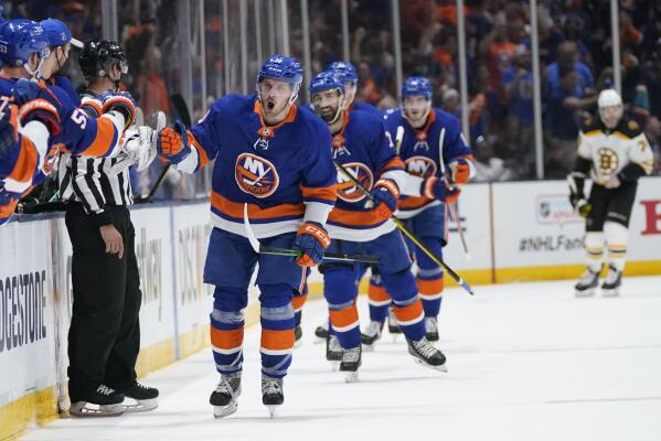 New York Islanders' Mathew Barzal (13) celebrates with teammates after scoring a goal during the third period of Game 4 during an NHL hockey second-round playoff series against the Boston Bruins, Saturday, June 5, 2021, in Uniondale, N.Y. (AP Photo/Frank Franklin II)