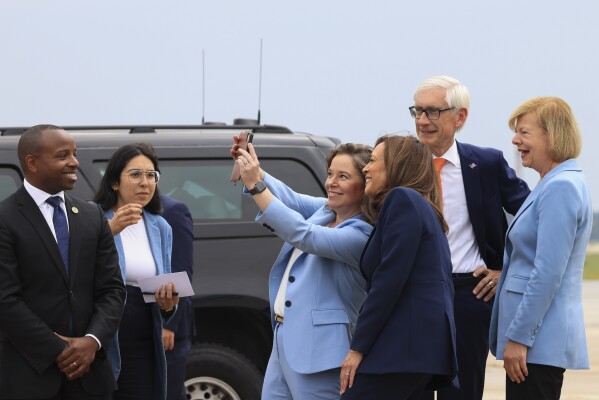 Vice President Kamala Harris poses for a selfie with Wisconsin Lt. Gov. Sara Rodriguez and Sen. Tammy Baldwin, D-Wisc., as she arrives in Milwaukee, Wisc., Tuesday, July 23, 2024.  (Kevin Mohatt/Pool through AP)