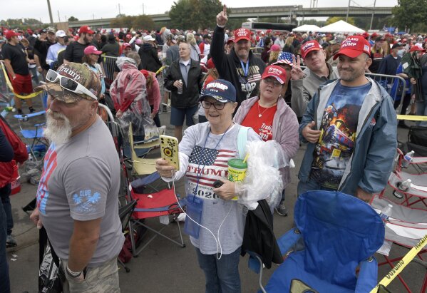 Supporters of President Donald Trump wait to enter a Trump campaign rally at Harrisburg International Airport, Saturday, Sept. 26, 2020, in Middletown, Pa. (AP Photo/Steve Ruark)