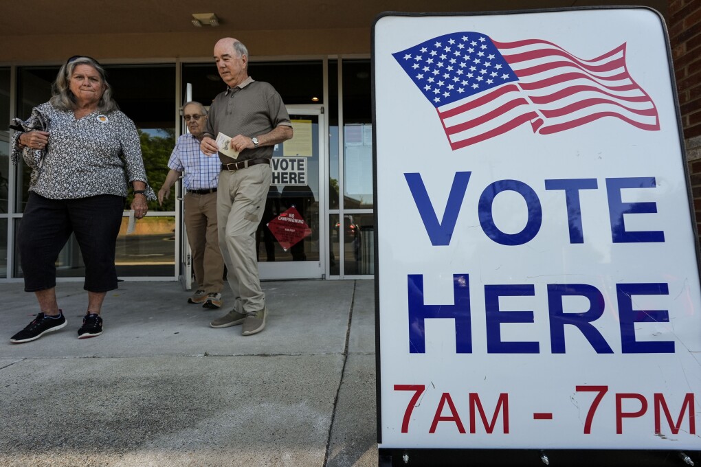 Voters depart an election center during primary voting, Tuesday, May 21, 2024, in Kennesaw, Ga. (AP Photo/Mike Stewart)