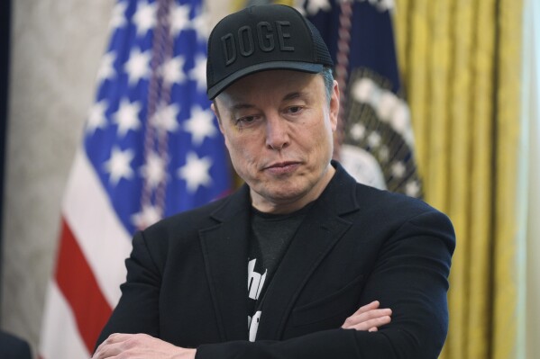 Elon Musk attends a news conference with President Donald Trump in the Oval Office of the White House, Friday, May 30, 2025, in Washington. (AP Photo/Evan Vucci)
