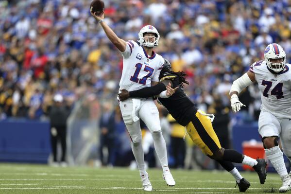Buffalo Bills quarterback Josh Allen (17) gets off a pass as he is hit by Pittsburgh Steelers linebacker Melvin Ingram during the second half of an NFL football game in Orchard Park, N.Y., Sunday, Sept. 12, 2021. (AP Photo/Joshua Bessex)
