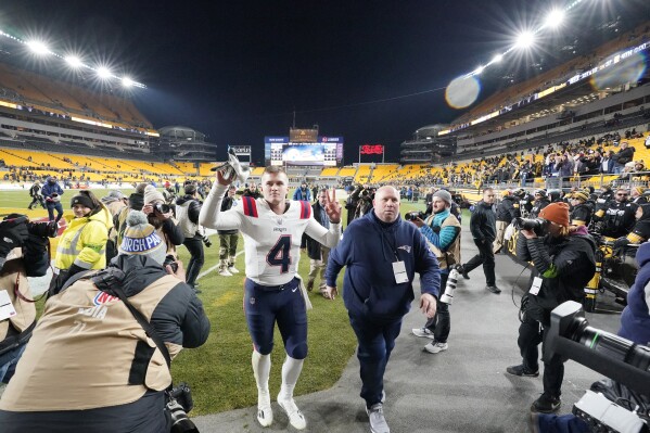 New England Patriots quarterback Bailey Zappe (4) walks off the field following an NFL football game against the Pittsburgh Steelers Thursday, Dec. 7, 2023, in Pittsburgh. The Patriots won 21-18. (APPhoto/Gene J. Puskar)