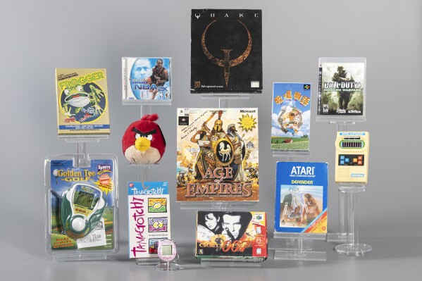This photo from the The Strong's World Video Game Hall of Fame in Rochester, N.Y., shows the 12 finalists being considered for induction in 2025: Age of Empires, Angry Birds, Call of Duty 4: Modern Warfare, Defender, Frogger, Golden Eye, Golden Tee, Harvest Moon, Mattel Football, Quake, NBA 2K, and Tamagotchi. (The Strong's World Video Game Hall of Fame via AP)