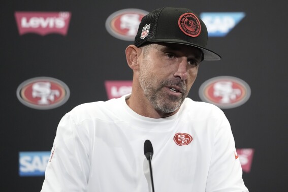San Francisco 49ers head coach Kyle Shanahan speaks to reporters after his team's NFL preseason football game against the Los Angeles Chargers in Santa Clara, Calif., Friday, Aug. 25, 2023. (AP Photo/Godofredo A. Vásquez)