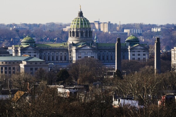 FILE - The Pennsylvania Capitol is seen, Dec. 16, 2021, in Harrisburg, Pa. Four of Pennsylvania’s top universities are getting closer to receiving their overdue state subsidies after the state House of Representatives passed their appropriation on Tuesday, Oct. 31, 2023, with the caveat the schools must freeze tuition next year. (AP Photo/Matt Rourke, File)