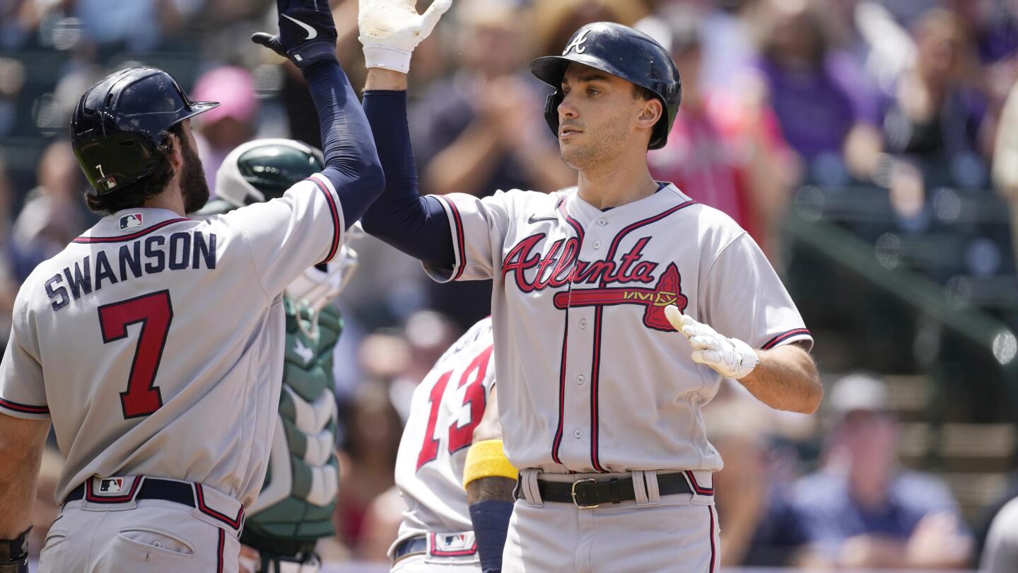 Dansby Swanson of the Atlanta Braves reacts as he crosses the plate