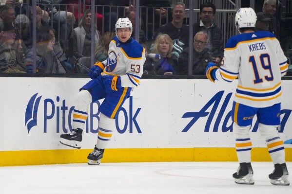 Buffalo Sabres left wing Jeff Skinner (53) reacts to scoring against the Seattle Kraken with center Peyton Krebs (19) during the first period of an NHL hockey game Monday, March 18, 2024, in Seattle. (AP Photo/Lindsey Wasson)