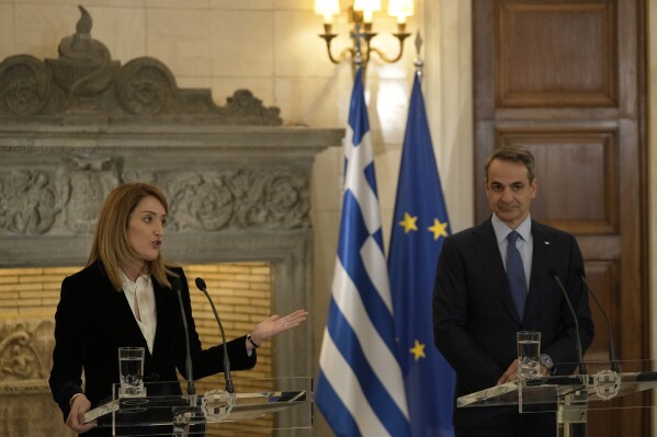 European Parliament President Roberta Metsola, left, makes a statement with Greece's Prime Minister Kyriakos Mitsotakis after their meeting at Maximos Mansion in Athens, Greece, Tuesday, Feb. 20, 2024. Metsola is in Athens on Tuesday, as part of her campaign to raise awareness and encourage people to vote in the European Parliament elections in June. (APPhoto/Thanassis Stavrakis)