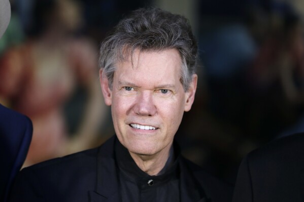 FILE - Randy Travis attends the announcement of the Country Music Hall of Fame inductees in Nashville, Tenn., on March 29, 2016. (AP Photo/Mark Humphrey, File)