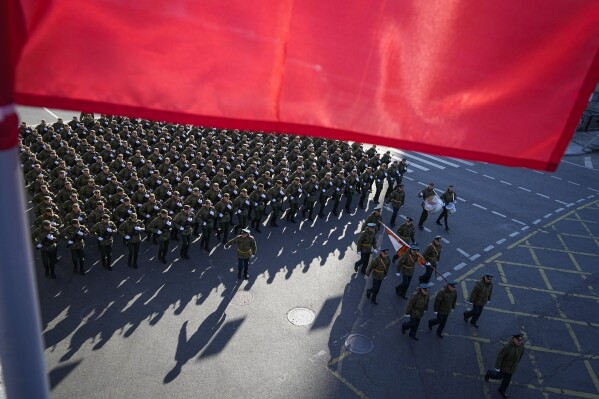 FILE - Russian soldiers march toward Red Square to attend a dress rehearsal for the Victory Day military parade in Moscow, Russia, Sunday, May 7, 2023. In Russia, history has long become a propaganda tool used to advance the Kremlin's political goals. In an effort to rally people around the flag, the authorities have sought to magnify the country's past victories while glossing over the more sordid chapters of its history. (AP Photo, File)