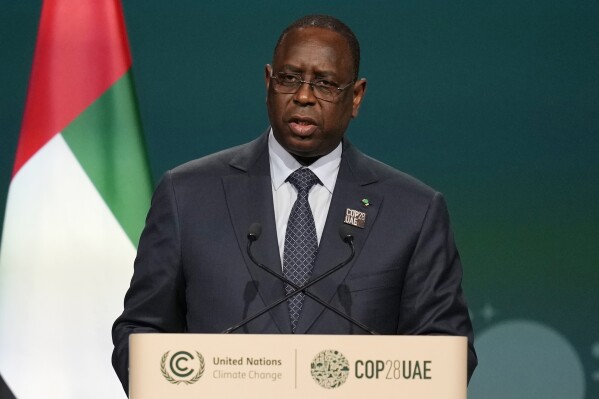 FILE - Senegal's President Macky Sall speaks during a plenary session at the COP28 U.N. Climate Summit, Friday, Dec. 1, 2023, in Dubai, United Arab Emirates. West Africa's regional bloc has urged authorities in Senegal to restore the nation’s electoral calendar after its presidential election was delayed. The bloc made the call on Monday just as the United Nations human rights office expressed concerns about the unprecedented decision in one of Africa’s most stable democracies. (AP Photo/Rafiq Maqbool, File)