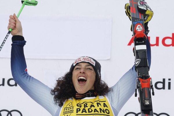 The winner Italy's Federica Brignone celebrates after an alpine ski, women's World Cup giant slalom, in Are, Sweden, Saturday, March 9, 2024. (AP Photo/Alessandro Trovati)