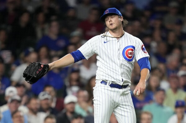 Chicago Cubs starting pitcher Justin Steele reacts after he was unable to throw out Pittsburgh Pirates' Connor Joe out at first on an infield hit during the fourth inning of a baseball game Wednesday, Sept. 20, 2023, in Chicago. (AP Photo/Charles Rex Arbogast)