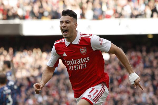 Arsenal's Gabriel Martinelli celebrates scoring the opening goal of the game during the English Premier League soccer match between, Arsenal and Nottingham Forrest at the Emirates stadium in London, Sunday, Oct. 30, 2022. (AP Photo/David Cliff)