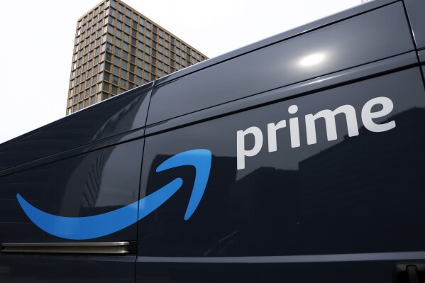 FILE - An Amazon Prime delivery vehicle is seen in downtown Pittsburgh on March 18, 2020. Amazon said Thursday, July 13, 2023 it had its biggest Prime day event ever this year. The e-commerce company did not reveal how much money it earned during the two-day sales event, which took place on Tuesday and Wednesday. But the company touted 375 million items that it says were purchased worldwide by Prime members, who pay $14.99 per month or $139 per year for different perks including faster shipping. (AP Photo/Gene J. Puskar, File)