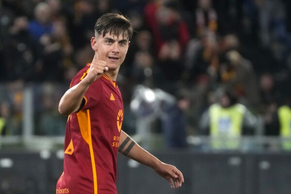 Roma's Paulo Dybala celebrates after scoring his side's third goal during the Italian Series A soccer match between Roma and Torino at Rome's Olympic stadium, Italy, Monday, Feb. 26, 2024. (AP Photo/Gregorio Borgia)