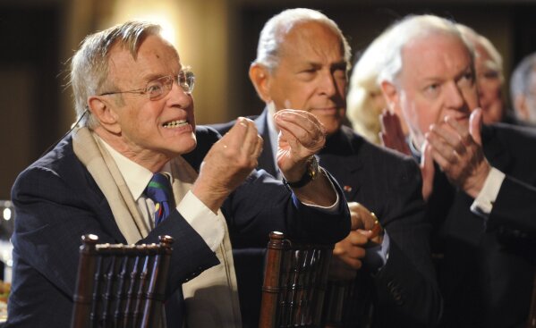 FILE - In this Monday, March 31, 2008 filer, Italian director and designer Franco Zeffirelli, left, reacts as various actors and singers he worked with are introduced at "Franco and Friends," the Metropolitan Opera Guild's all-star tribute to him, in New York. Italian film director Franzo Zeffirelli has died in Rome at the age of 96. Zefffirelli's son Luciano said his father died at home on Saturday at noon. (AP Photo/Henny Ray Abrams, File)