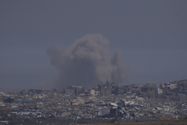 Smoke rises to the sky in the Gaza Strip as seen from southern Israel, Tuesday, May 6, 2025. (AP Photo/Ohad Zwigenberg)