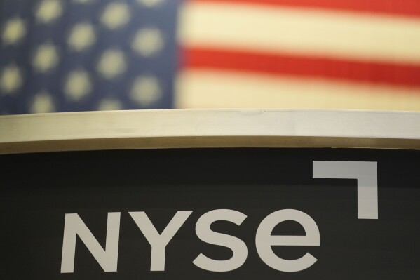 An NYSE sign is displayed on the floor at the New York Stock Exchange in New York, Thursday, Jan. 2, 2025. (AP Photo/Seth Wenig, File)