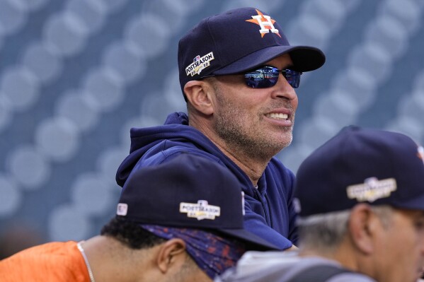 FILE - Houston Astros bench coach Joe Espada watches batting practice ahead of Game 2 of baseball's American League Championship Series between the Houston Astros and the New York Yankees, Thursday, Oct. 20, 2022, in Houston. Espada will be introduced as manager of the Houston Astros on Monday, Nov. 13, 2023, a person familiar with the hiring told The Associated Press. The person spoke to the AP on condition of anonymity Sunday because the team hadn’t announced the decision. (AP Photo/Kevin M. Cox)