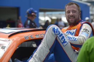 FILE - In this July 5, 2013 file photo, Eric McClure gets out of his car after finishing his laps during qualifying for a NASCAR Nationwide auto race at Daytona International Speedway in Daytona Beach, Fla. Former NASCAR driver McClure died Sunday, May 2, 2021, his family and the series said. He was 42. (AP Photo/Phelan M. Ebenhack, File)
