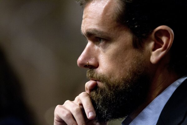 FILE - In this Sept. 5, 2018, file photo Twitter CEO Jack Dorsey testifies before a Senate Intelligence Committee hearing in Washington. "While internet advertising is incredibly powerful and very effective for commercial advertisers, that power brings significant risks to politics, where it can be used to influence votes to affect the lives of millions," Dorsey said Wednesday, Oct. 30, 2019, in a series of tweets announcing Twitters new policy of banning all political advertising from its service. (AP Photo/Jose Luis Magana, File)