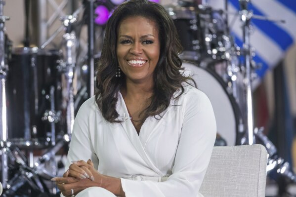 FILE - In this Oct. 11, 2018, file photo, Michelle Obama participates in the International Day of the Girl on NBC's "Today" show in New York.  The former first lady announced that Selena Gomez, Liza Koshy, Shonda Rhimes, Megan Rapinoe, Tracee Ellis Ross and Kerry Washington have signed on as co-chairs of the national organization When We All Vote.  The announcement Thursday, Nov. 7, 2019 marks a year until the date of the 2020 elections, which includes the presidential race. (Photo by Charles Sykes/Invision/AP, File)