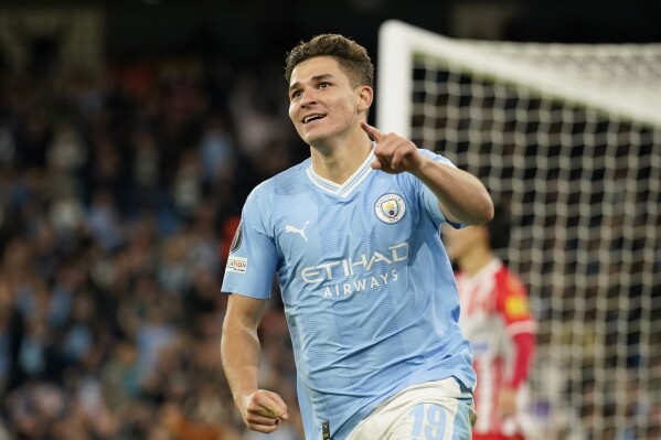 Manchester City's Julian Alvarez celebrates after scoring his side's first goal during the Champions League group G soccer match between Manchester City and Red Star Belgrade in Manchester, England, Tuesday Sept. 19, 2023. (AP Photo/Dave Thompson)