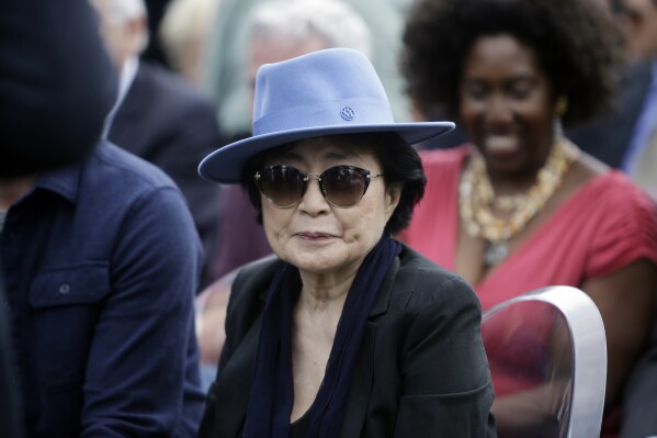 FILE - Yoko Ono appears before the dedication ceremony for her permanent art installation, a sculpture called SKYLANDING, at Jackson Park, Oct. 17, 2016, in Chicago. One of the country’s leading artist residency programs, MacDowell, has awarded a lifetime achievement prize to Ono. The groundbreaking artist, filmmaker and musician is the 2024 recipient of the Edward MacDowell Medal, an honor previously given to Stephen Sondheim and Toni Morrison among others. (AP Photo/Kiichiro Sato, File)