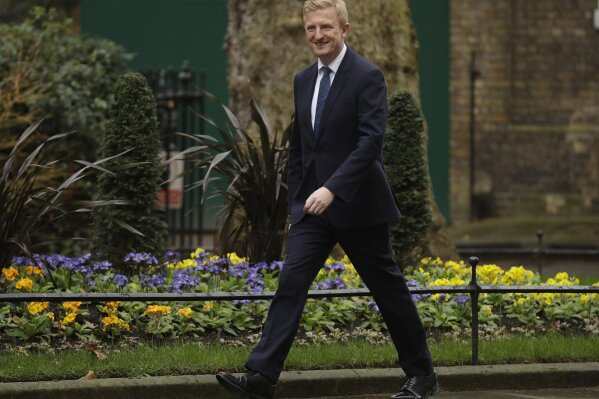 British lawmaker Oliver Dowden, the Paymaster General and Minister for the Cabinet Office arrives at 10 Downing Street in London, Thursday, Feb. 13, 2020. British Prime Minister Boris Johnson shook up his government on Thursday, firing and appointing ministers to key Cabinet posts. Johnson was aiming to tighten his grip on government after winning a big parliamentary majority in December's election. That victory allowed Johnson to take Britain out of the European Union in January. (AP Photo/Matt Dunham)