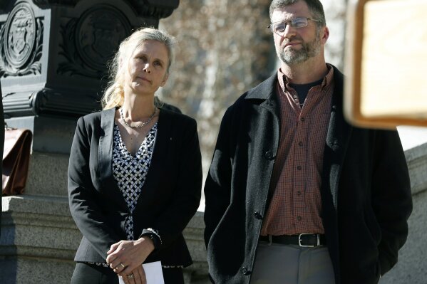 
              FILE - In this Feb. 19, 2015 file photo Hope, left, and Mike Reilly of Pueblo, Colo., attend a news conference in reaction to the announcement that a federal lawsuit is being filed on behalf of the couple by a Washington D.C.-based group to shut down the state's $800-million-a-year marijuana industry, in Denver. A federal trial in Colorado on Monday, Oct. 29, 2018, could have far-reaching effects on the budding U.S. marijuana industry if a jury sides with the couple who say having a cannabis business as a neighbor hurts their property's value. (AP Photo/David Zalubowski, File)
            