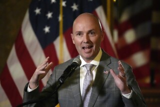 FILE - Utah Gov. Spencer Cox speaks during a news briefing, Friday, March 1, 2024, in Salt Lake City. Cox, Wednesday, March 13, 2024, has approved an overhaul of social media laws meant to shield children from potential harms as the state fends off multiple lawsuits challenging their constitutionality. (AP Photo/Rick Bowmer, File)