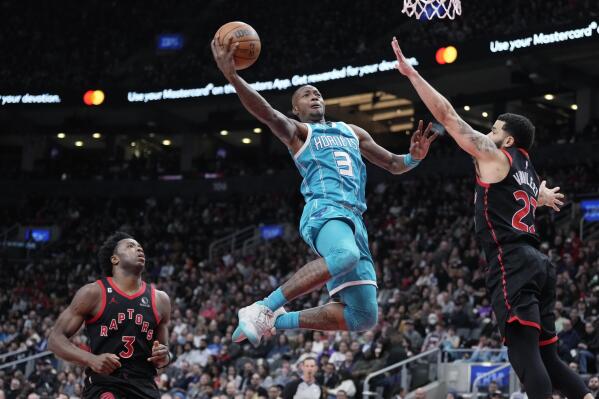 Charlotte Hornets guard Terry Rozier (3) goes to the basket as Toronto Raptors guard Fred VanVleet, right, defends during the second half of an NBA basketball game Thursday, Jan. 12, 2023, in Toronto. (Frank Gunn/The Canadian Press via AP)