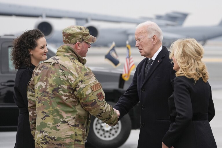President Joe Biden and first lady Jill Biden, greet Col. Chris McDonald, Commander of 436th Airlift Wing at Dover Air Force Base, and his wife Diana McDonald at Dover Air Force Base, Del., Friday, Feb. 2, 2024. (AP Photo/Alex Brandon)