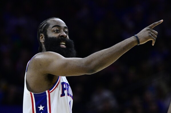 FILE - Philadelphia 76ers' James Harden plays during an NBA basketball game against the Denver Nuggets, Saturday, Jan. 28, 2023, in Philadelphia. Harden appears determined to sever ties with the Philadelphia 76ers after the star guard called team president Daryl Morey a liar at a promotional event at China. (AP Photo/Derik Hamilton, File)