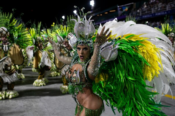 A performer from the Unidos da Tijuca samba school dances during Carnival celebrations at the Sambadrome in Rio de Janeiro, Monday, March 3, 2025. (AP Photo/Bruna Prado)