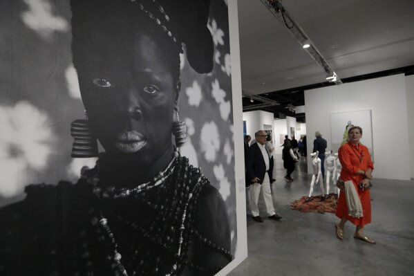 Artwork by Zanele Muholi is displayed at the Stevenson Gallery during Art Basel Miami Beach, Wednesday, Dec. 4, 2019, in Miami Beach, Fla. The annual exhibition features artwork from over 200 of the world's modern and contemporary art galleries. (AP Photo/Lynne Sladky)