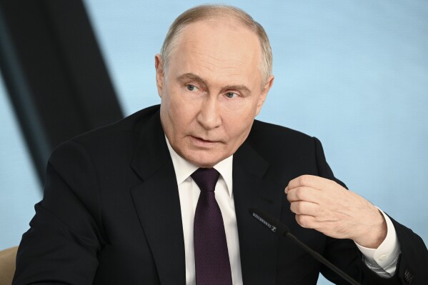 Russian President Vladimir Putin speaks to senior news leaders of international news agencies on the sidelines of the St. Petersburg International Economic Forum at the Lakhta Center skyscraper, the headquarters of Russian gas monopoly Gazprom in St. Petersburg, Russia, on Wednesday, June 5, 2024. The Russian leader has used the annual forum as a showcase for touting Russia's development and seeking investors. (Vladimir Astapkovich, Sputnik, Kremlin Pool Photo via AP)