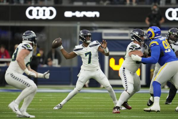Seattle Seahawks quarterback Geno Smith throws during the first half of an NFL football game against the Los Angeles Rams Sunday, Dec. 4, 2022, in Inglewood, Calif. (AP Photo/Marcio Jose Sanchez)