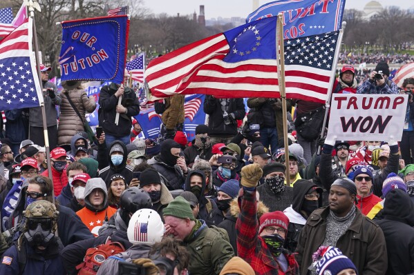 FILE - Rioters are seen at the U.S. Capitol on Jan. 6, 2021, in Washington. Judges overseeing the cases against the rioters are using their platform to try to combat distortions about the attack that have been promoted by Donald Trump and his allies. Judges appointed by presidents from both political parties have described the riot as an affront to democracy and admonished defendants for casting themselves as the victims of politically motivated prosecutions. (AP Photo/John Minchillo, File)