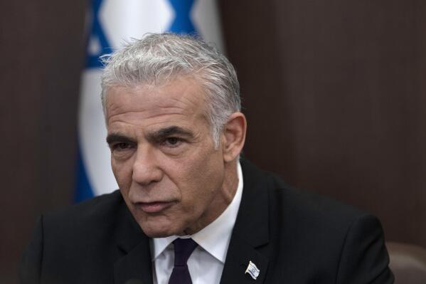 Israeli Prime Minister Yair Lapid speaks at the start of the the weekly cabinet meeting in Jerusalem, Sunday, July 10, 2022.(AP Photo/Maya Alleruzzo, Pool)