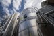 FILE - A liquid carbon dioxide containment unit stands outside the fabrication building of Glenwood Mason Supply Company, April 18, 2023, in the Brooklyn borough of New York. (APPhoto/John Minchillo, File)